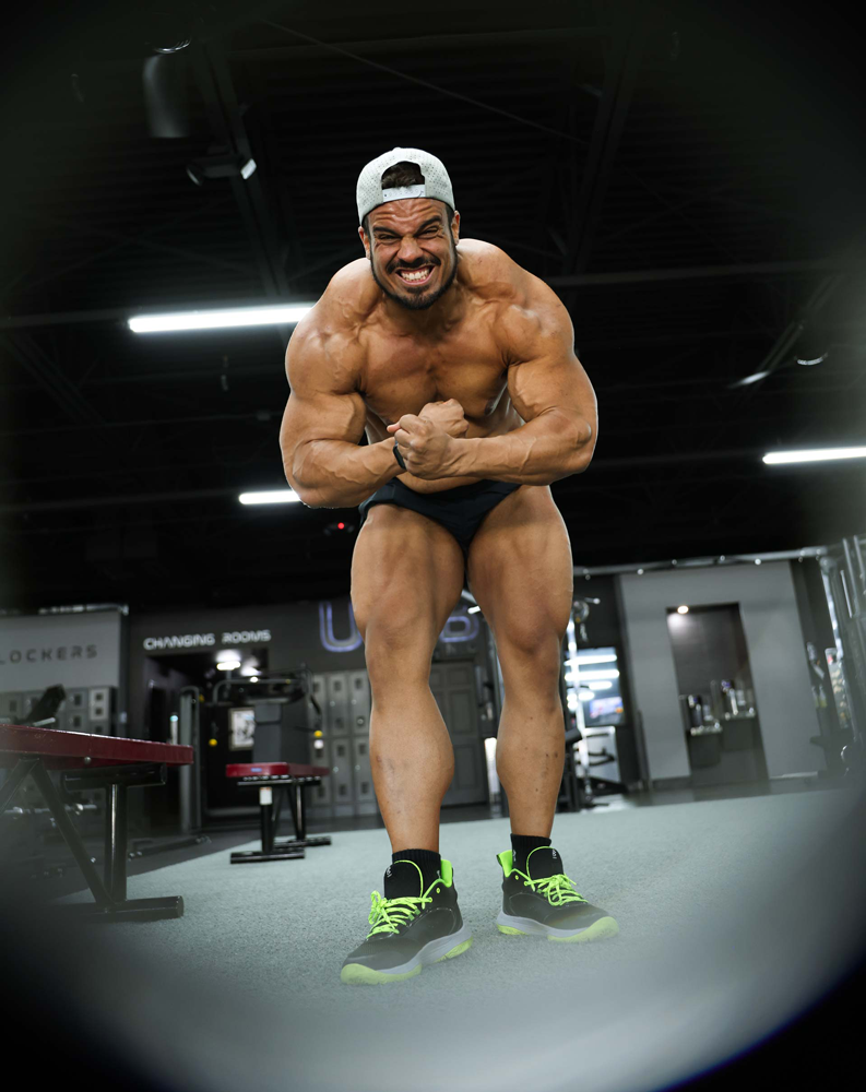 Coach showing his body muscles